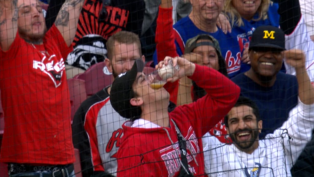 IMPORTANT: Female fan catches foul ball in beer cup and chugs it 