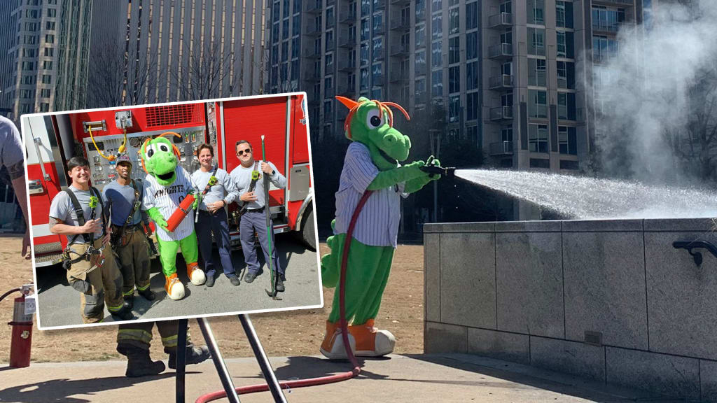 Charlotte Knights dragon mascot homer puts out fire