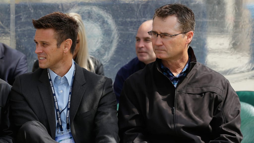 GM Jerry Dipoto and manager Scott Servais look to pilot Seattle to its first postseason berth since 2001. (AP)