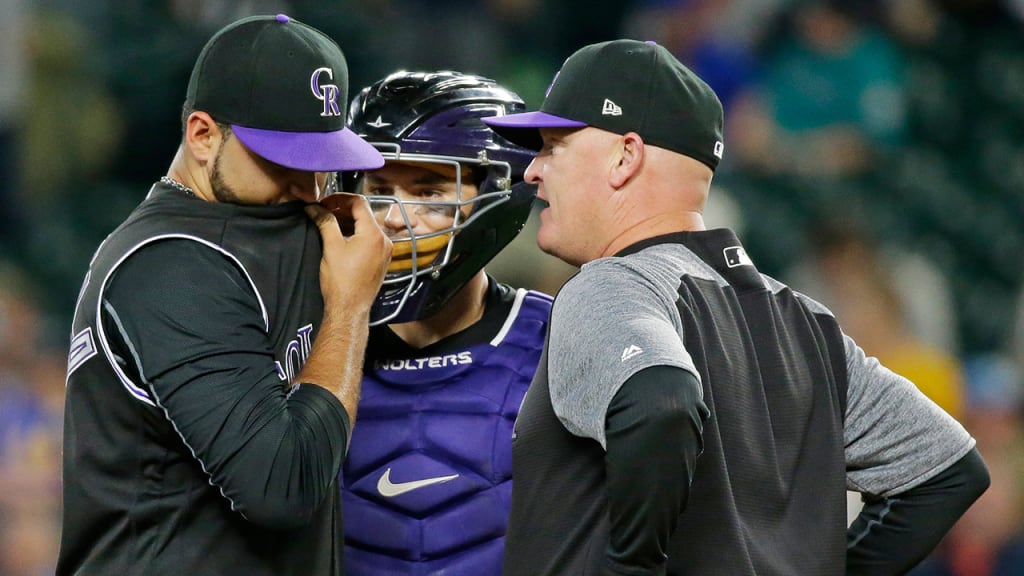 Pitching coach Steve Foster (right) talks with starter Antonio Senzatela and catcher Tony Wolters. (AP)