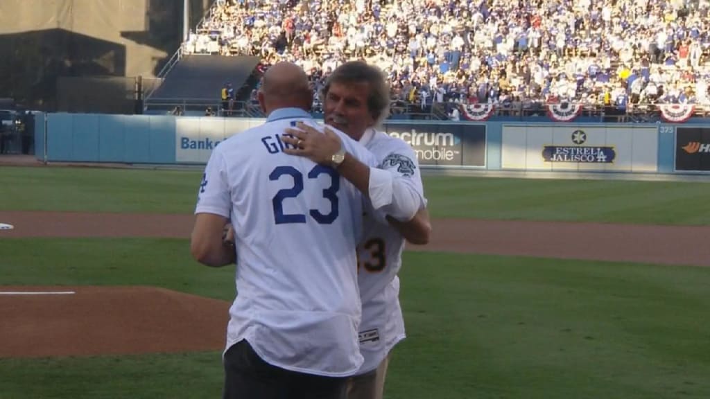 Kirk Gibson and Dennis Eckersley teamed up for a ceremonial first pitch  before Game 4 of the World Series