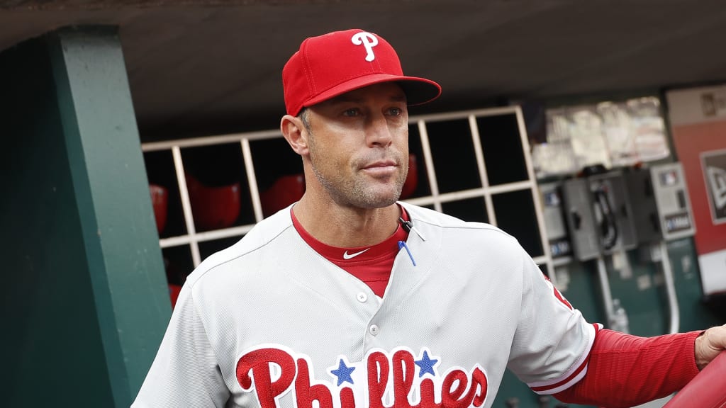 Philadelphia Phillies manager Gabe Kapler stands in the dugout in the second inning of a baseball game against the Cincinnati Reds, Saturday, July 28, 2018, in Cincinnati. (AP Photo/John Minchillo)