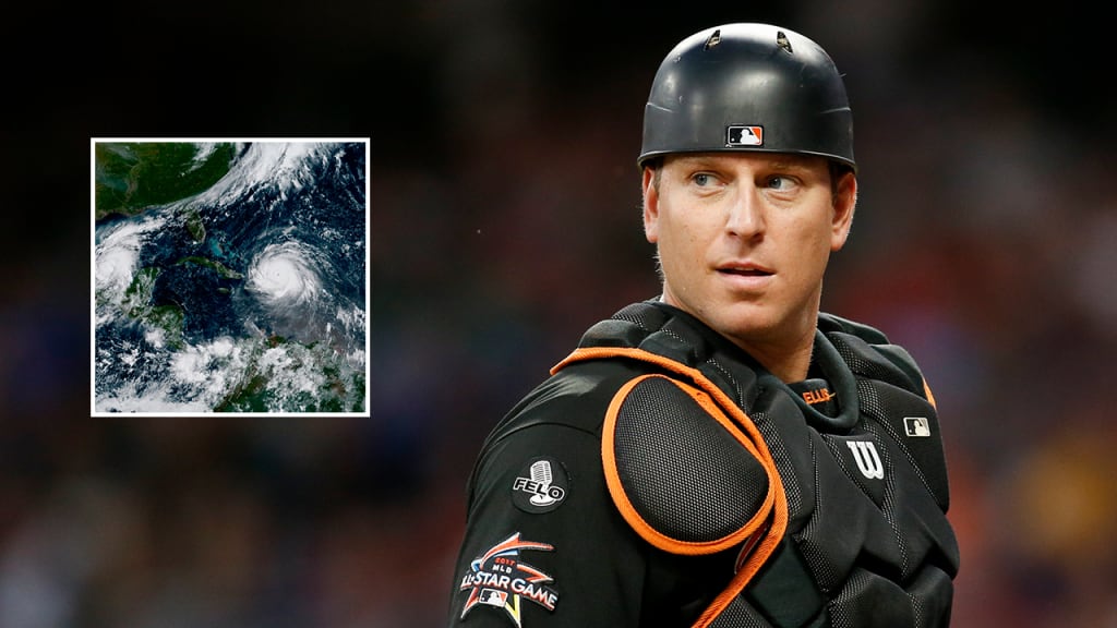TVs in the Marlins' clubhouse were tuned to The Weather Channel on Friday as A.J. Ellis, pictured, and teammates watch Hurricane Irma track toward Florida. (AP)