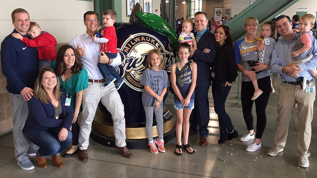 Brewers radio broadcasters Lane Grindle and Jeff Levering and media relations employees Mike Vassallo and Ken Spindler with their families.