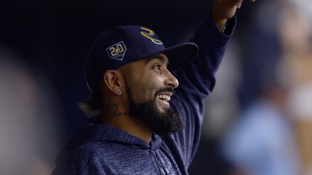Tampa Bay Rays Sergio Romo (54) jokes around in the dugout during a baseball game against the Chicago White Sox Sunday, Aug. 5, 2018, in St. Petersburg, Fla. (AP Photo/Jason Behnken)