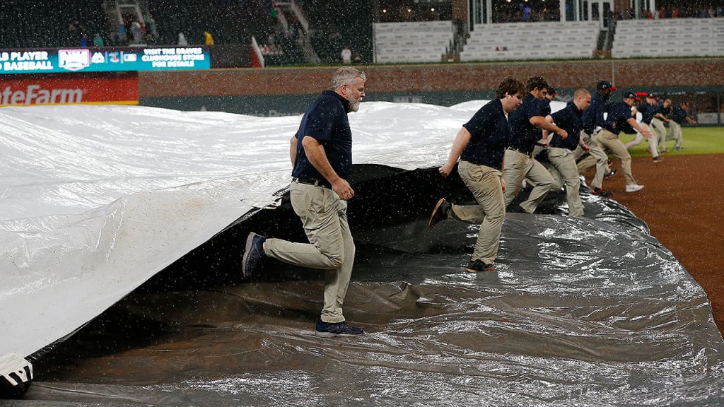 While the tarp was on the field Tuesday night, the Braves found a way to have fun in the clubhouse. (AP)