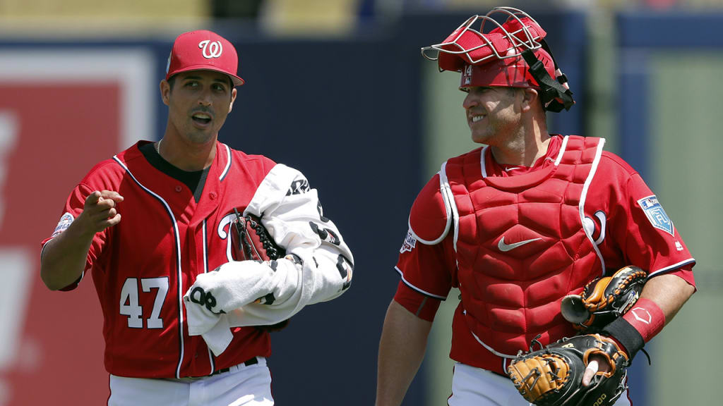 Washington Nationals starting pitcher Gio Gonzalez, left, talks with catcher Miguel Montero as they walk to the dugout for the start of a spring training baseball game against the Houston Astros Wednesday, March 21, 2018, in West Palm Beach, Fla. (AP Photo/John Bazemore)