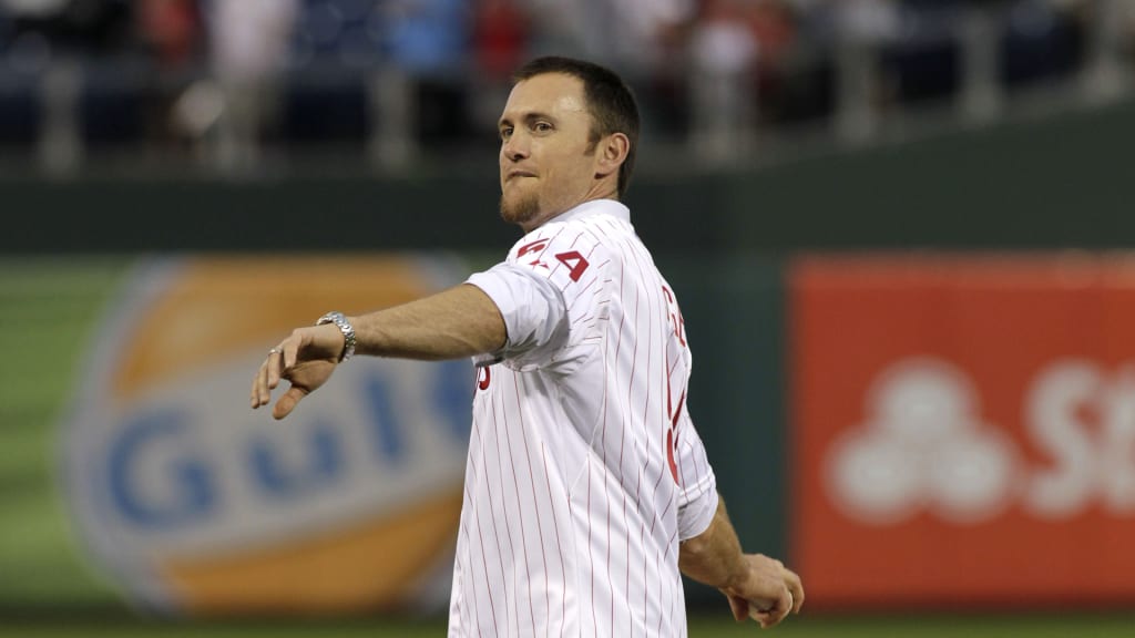 Former Philadelphia Phillies pitcher Brad Lidge throws the first pitch, Thursday, Aug. 1, 2013, in Philadelphia. (AP Photo/H. Rumph Jr)