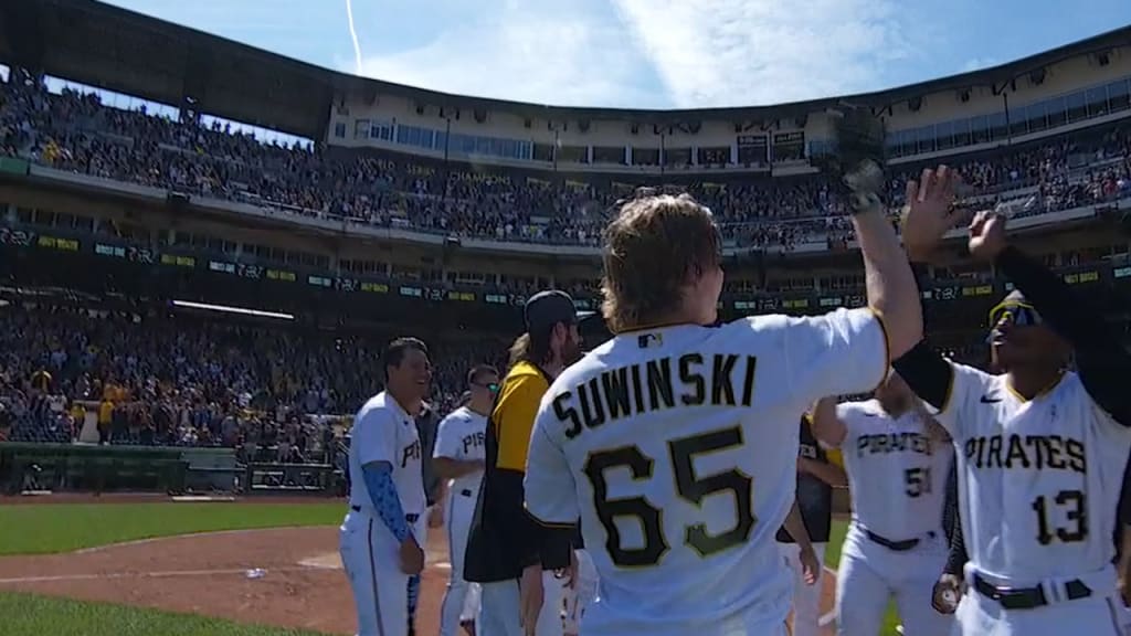 Pittsburgh Pirates center fielder Jack Suwinski reaches for a ball