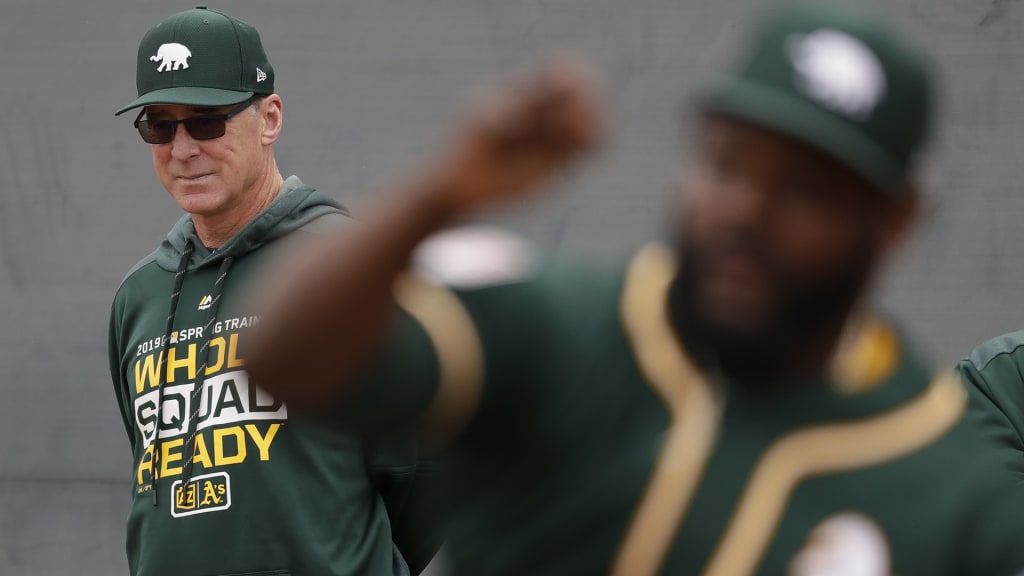 Oakland Athletics manager Bob Melvin, left, watches Fernando Rodney throw at their spring baseball training facility in Mesa, Ariz., Thursday, Feb. 14, 2019. (AP Photo/Chris Carlson)