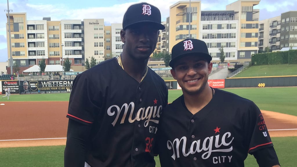 Chicago Cubs' Nick Madrigal, right, steals second as Cincinnati