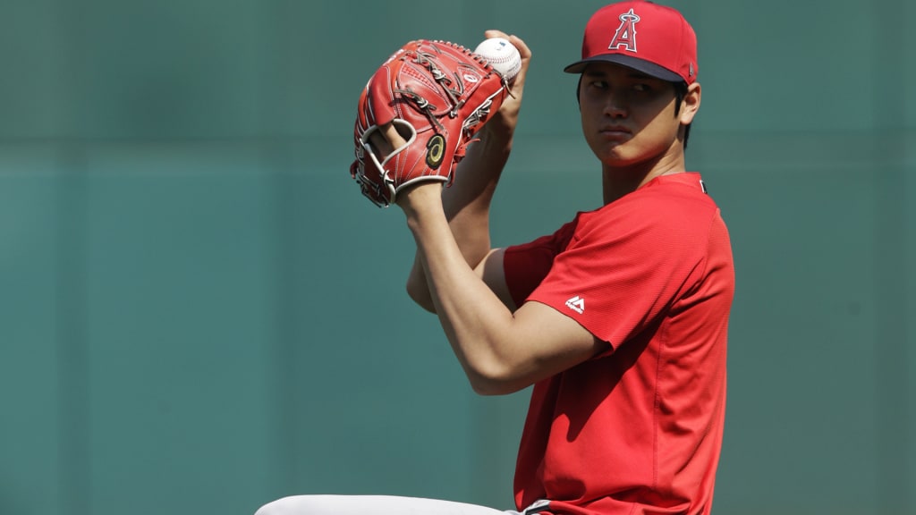 Los Angeles Angels' Shohei Ohtani warms up before a baseball game between the Cleveland Indians and the Angels, Sunday, Aug. 5, 2018, in Cleveland. (AP Photo/Tony Dejak)