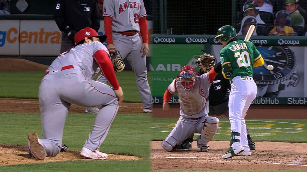 Mark Canha barks at Shohei Ohtani after a pitch almost hit him. Shohei