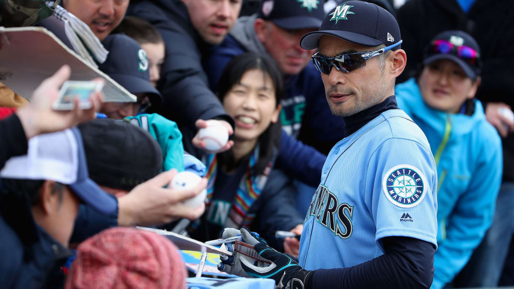 Former Seattle Mariners' player Ichiro Suzuki signs autographs