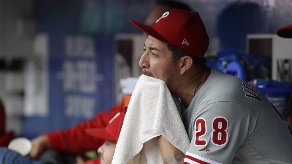 Philadelphia Phillies pitcher Vince Velasquez sits in the dugout after being relieved in the fifth inning of a baseball game against the New York Mets, Sunday, Sept. 9, 2018, in New York. (AP Photo/Mark Lennihan)