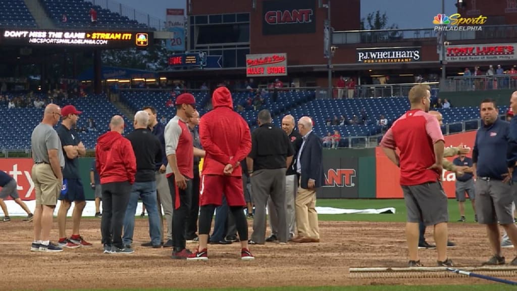 Phillies grounds crew uses blowtorch on field