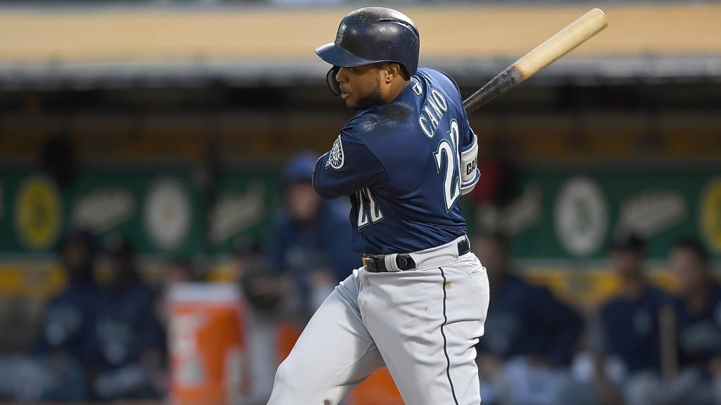 OAKLAND, CA - AUGUST 30: Robinson Cano #22 of the Seattle Mariners hits an rbi single scoring Denard Span #4 against the Oakland Athletics in the top of the second inning at Oakland Alameda Coliseum on August 30, 2018 in Oakland, California. (Photo by Thearon W. Henderson/Getty Images)