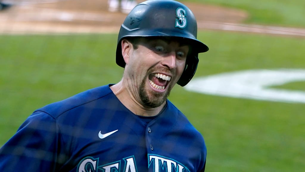 Seattle Mariners' Tom Murphy reacts in the dugout after he hit a