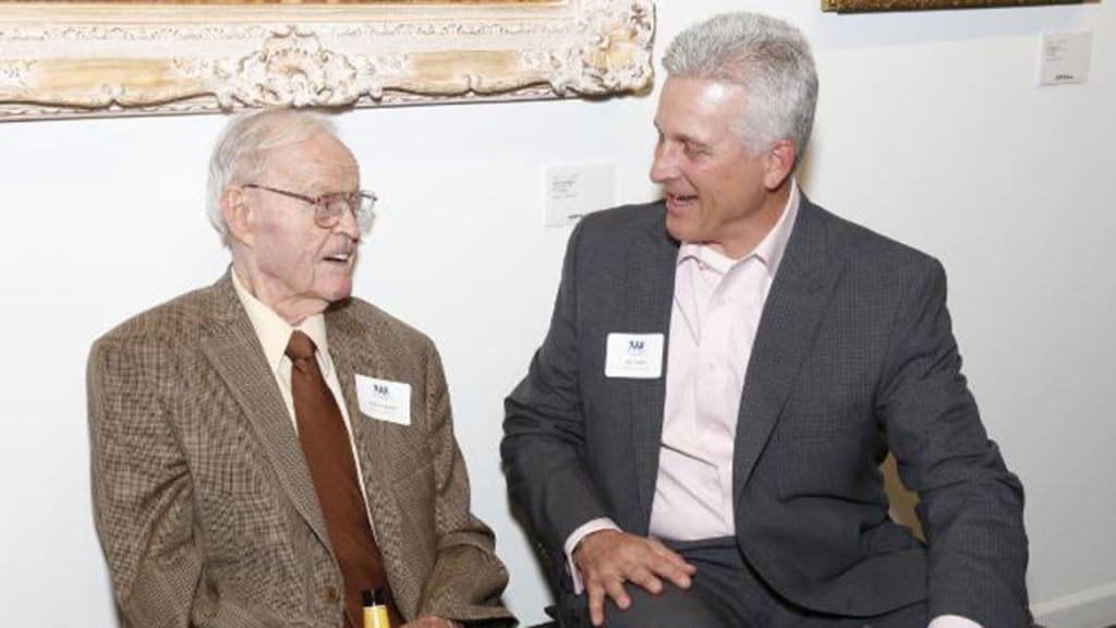 Eddie Carnett (left, with fellow former big leaguer Pat Combs) appeared in 158 big league games from 1941-45.