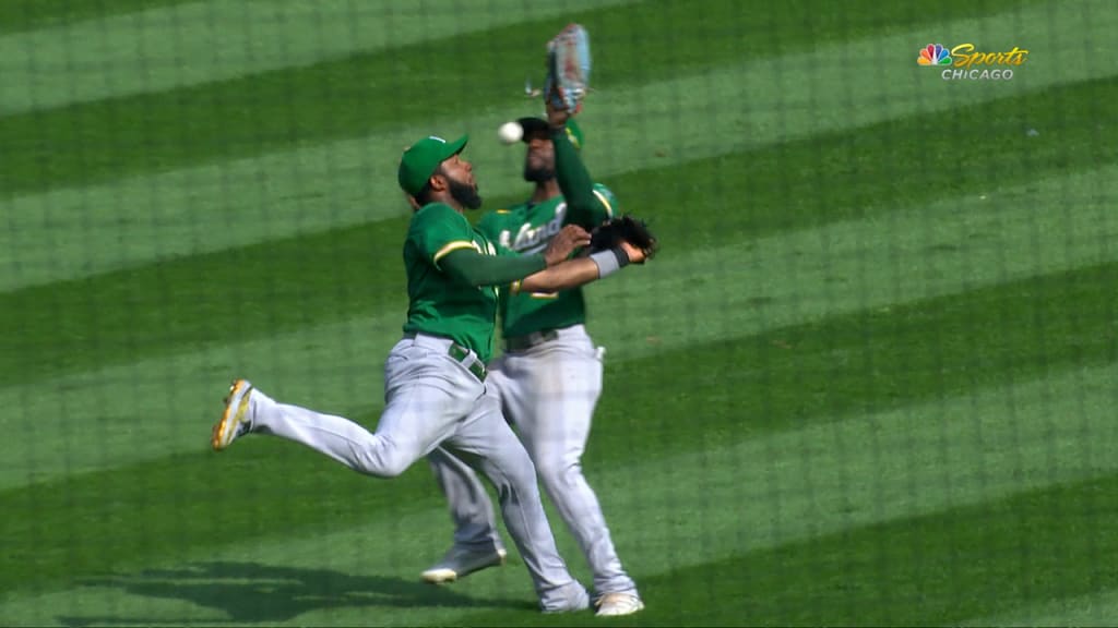 Oakland Athletics center fielder Starling Marte, left, and shortstop Elvis  Andrus, collide going after a fly ball hit by Chicago White Sox's Jose  Abreu in the ninth inning of a baseball game