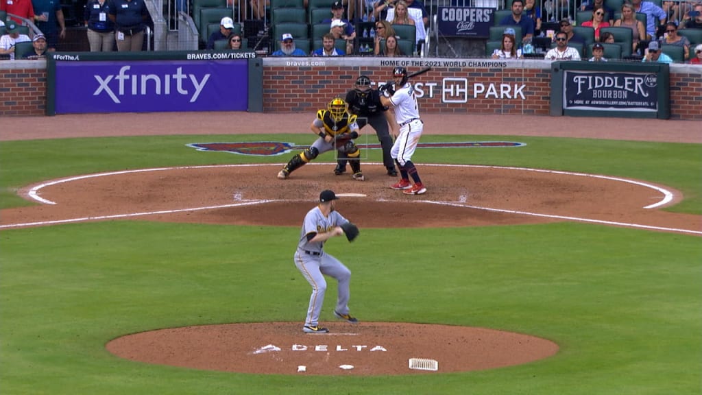 Atlanta Braves' Ronald Acuña Jr. knocked to the ground after two fans run  onto Coors Field