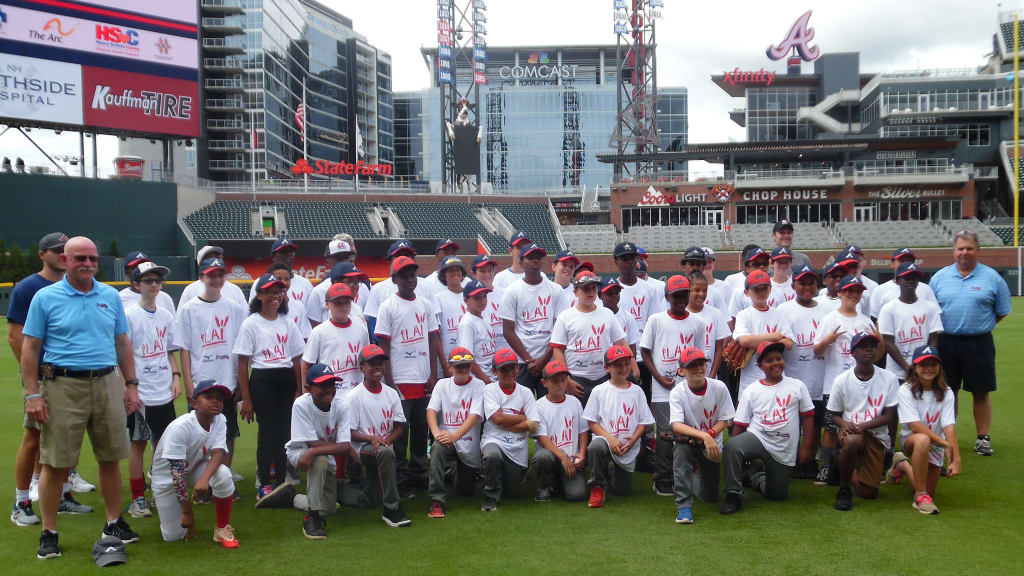 Youth participants pose with coaches on Tuesday at SunTrust Park. (Jaylon Thompson)