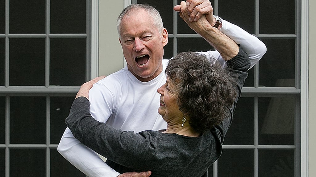 Jim Bouton dances with his wife, Paula Kurman, outside their home in the Berkshires. (Getty)