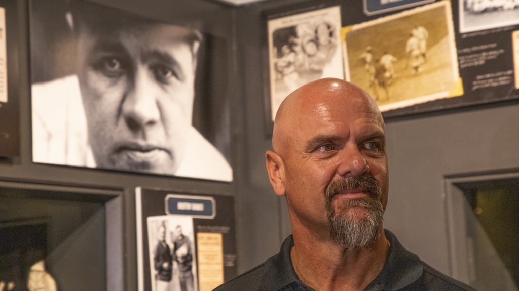 Walker at a Museum exhibit titled "Babe Ruth: His Life and Legend."
