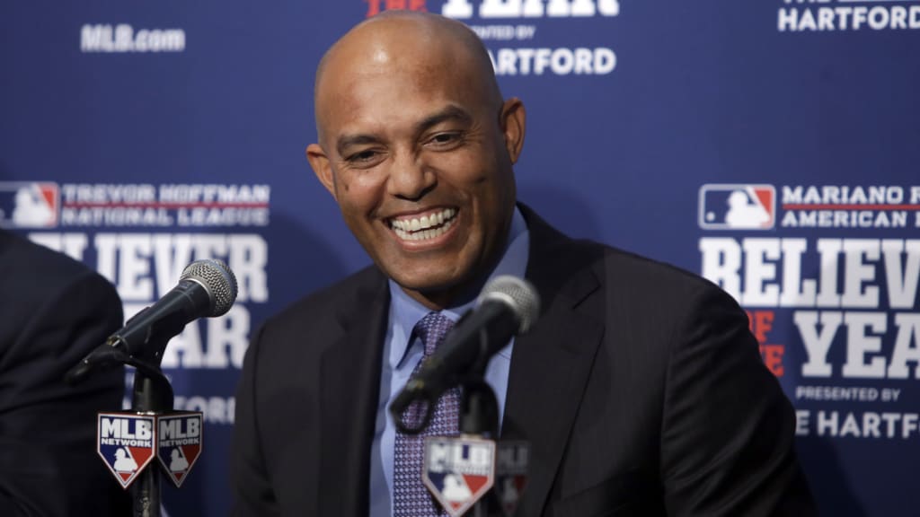 Former New York Yankees pitcher Mariano Rivera laughs during a news conference as he introduces the 2016 Mariano Rivera American League Reliever of the Year award winner Baltimore Orioles' Zach Britton before Game 4 of the Major League Baseball World Series between the Chicago Cubs and the Cleveland Indians, Saturday, Oct. 29, 2016, in Chicago. (AP Photo/Kiichiro Sato)