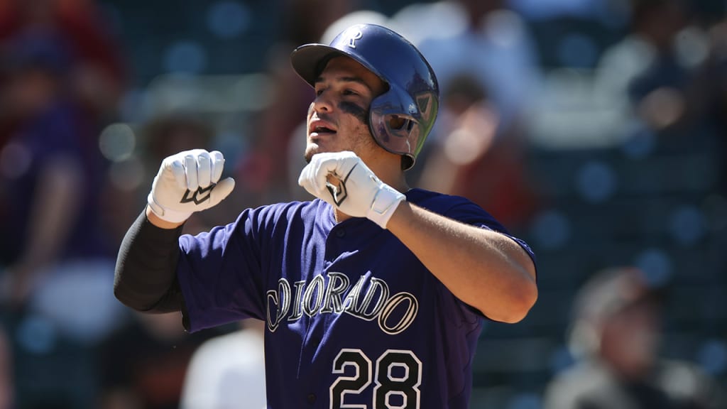 "When he was growing up, we tried to keep everything balanced," Millie Arenado said about her son, Nolan. (AP)