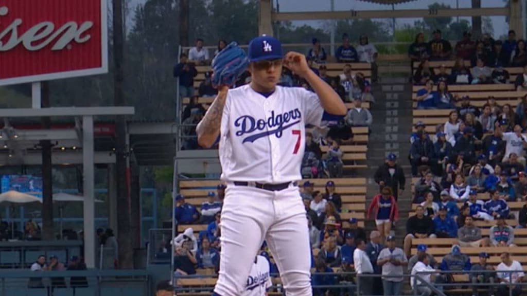 Dodgers pitcher Julio Urias works register at Jack in the Box for