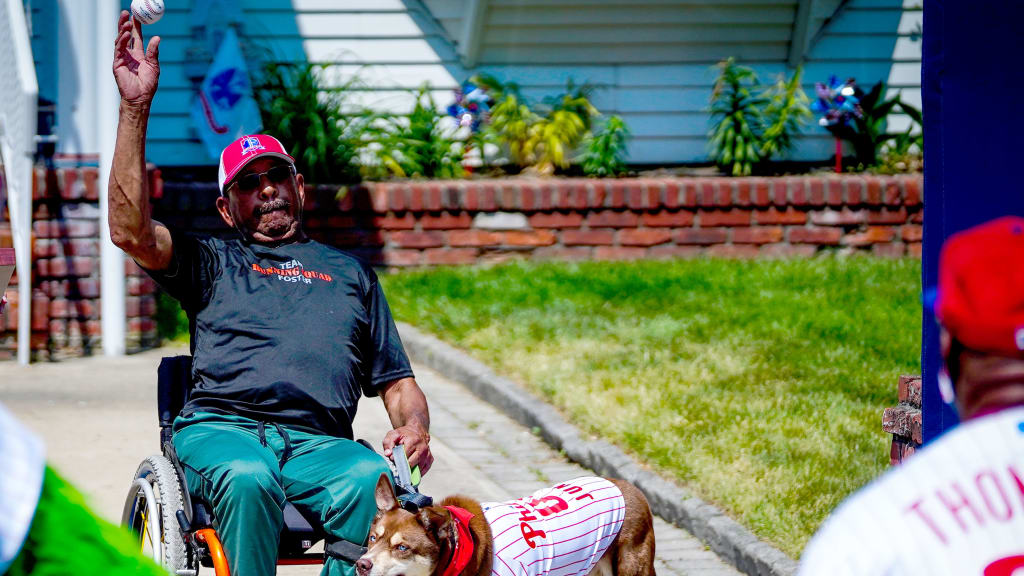 First Sergeant Arthur "Sonny" Wimberly tosses a practice first pitch to former Phillies player Milt Thompson.