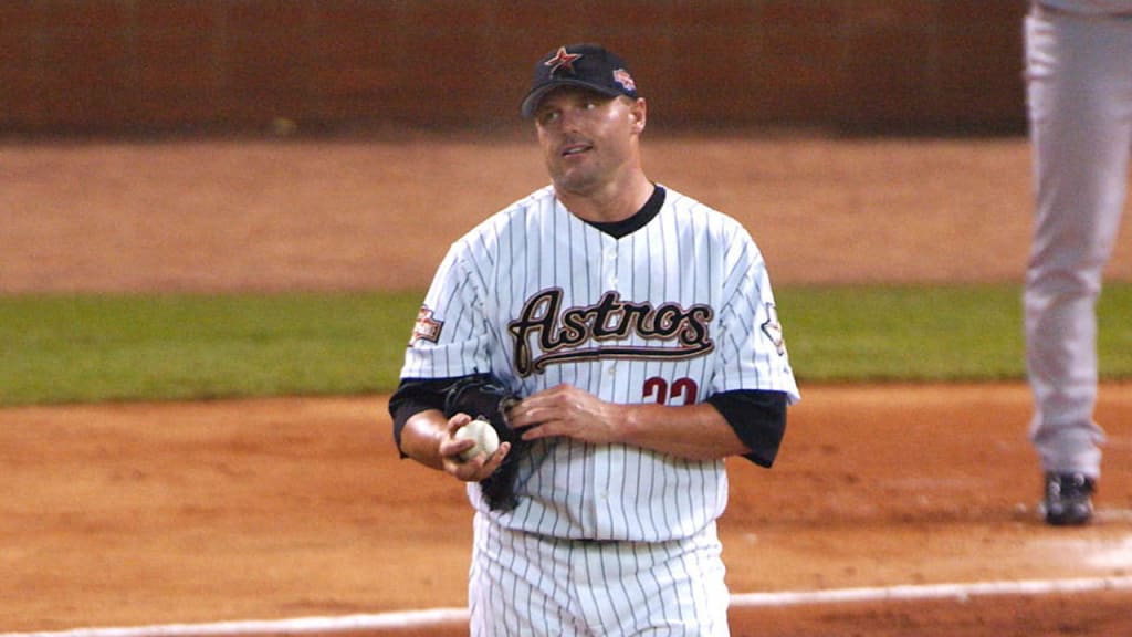 Roger Clemens reacts as Alfonso Soriano rounds second base after hitting a three-run home run during the first inning. (AP)