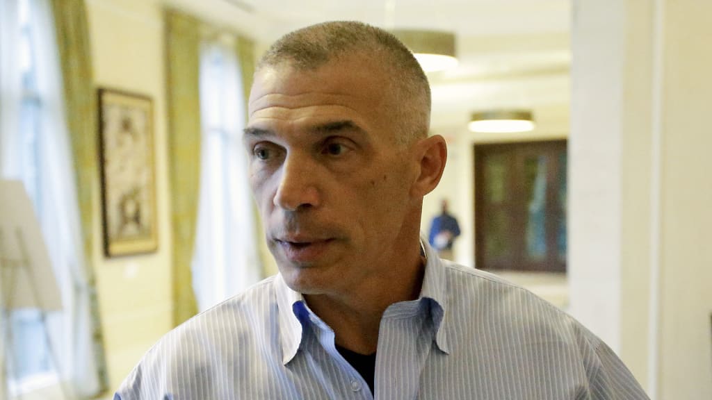 Former New York Yankees manager Joe Girardi talks with reporters at the annual MLB general managers' meetings, Tuesday, Nov. 14, 2017, in Orlando, Fla. (AP Photo/John Raoux)