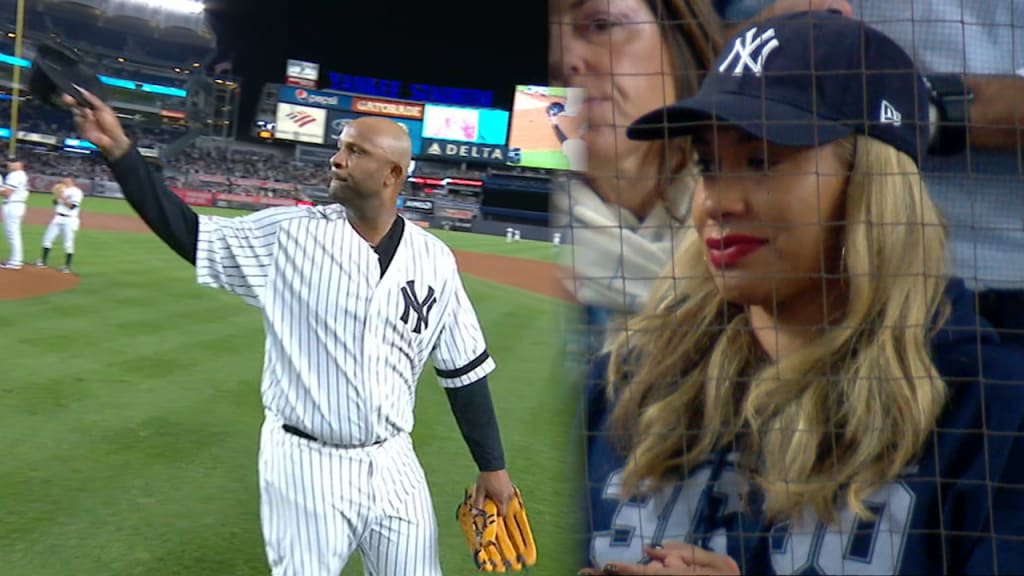 New York Yankees starting pitcher CC Sabathia wipes his face on