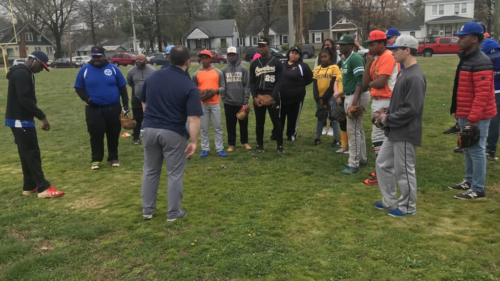Teenage participants receiving fielding instruction at the April 2019 Play Ball event in Richmond.