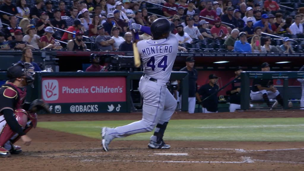 Colorado Rockies' Zac Veen (73) scores past Seattle Mariners