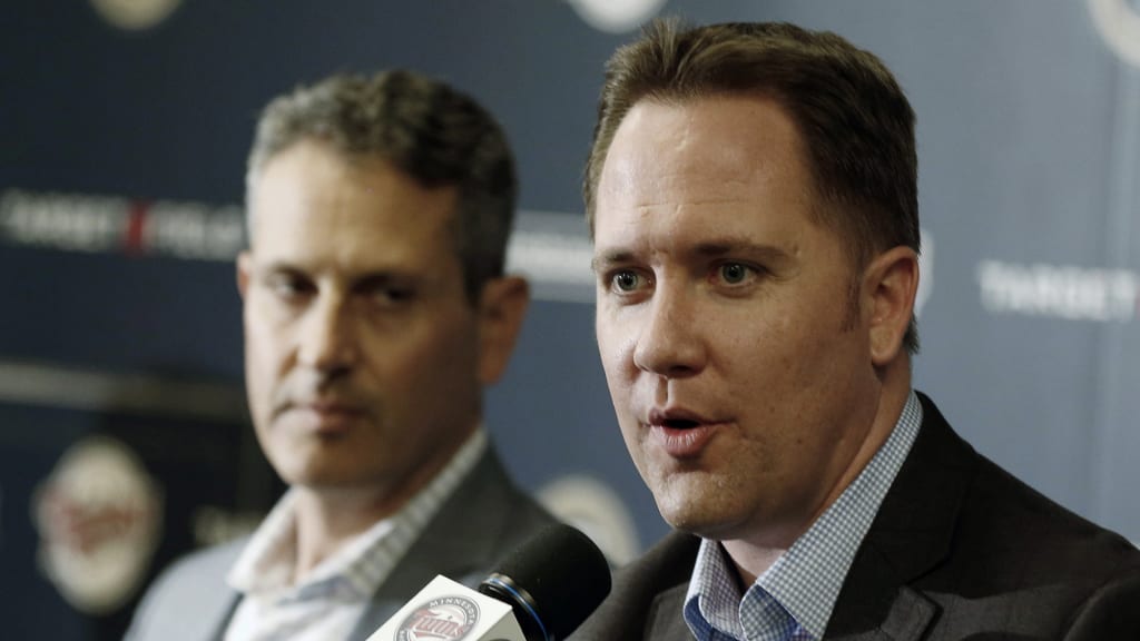 Minnesota Twins chief baseball officer Derek Falvey, right, addresses a news conference Tuesday, Oct.2, 2018 in Minneapolis she he announced that Minnesota Twins manager Paul Molitor was fired, one season after he won the American League Manager of the Year award. In four seasons under Molitor, the Twins went 305-343 with one appearance in the playoffs in 2017. They were 78-84 this year, long out of postseason contention after a series of early setbacks to several key players. Listening at left is general manager Thad Levine. (AP Photo/Jim Mone)