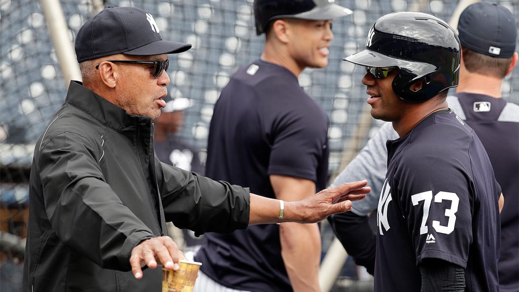 Seahawks quarterback Russell Wilson (73) talks with Hall of Famer Reggie Jackson during Yankees batting practice on March 2, 2018, in Tampa, Fla.