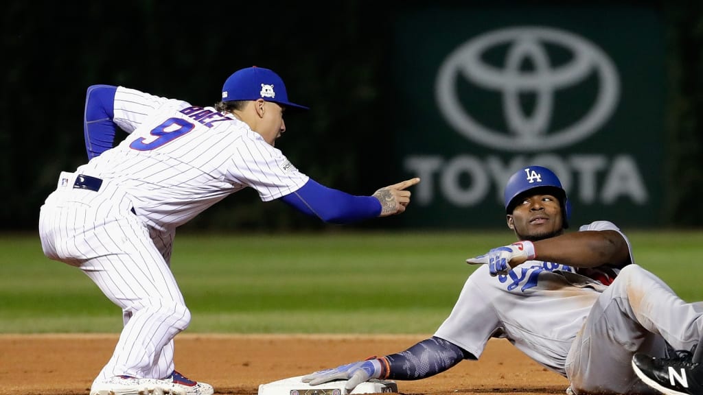 After Yasiel Puig tried and failed to avoid Javy Baez's tag, Baez