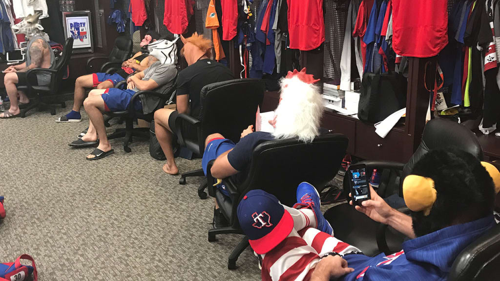 Mike Napoli was a giraffe, Joey Gallo was a rooster and Rougned Odor donned a chimpanzee mask -- all provided by Andrew Cashner. (Sam Butler/MLB.com)