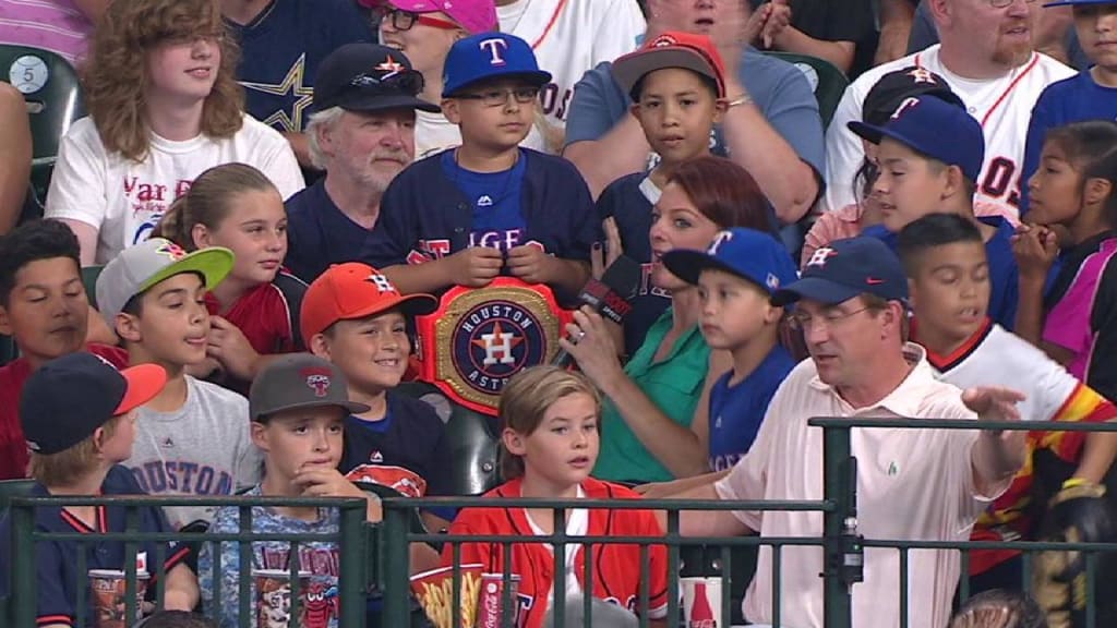 Astros fan wears WWE belt