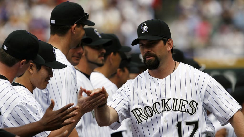 Todd Helton is greeted by teammates on Opening Day 2007. (AP)