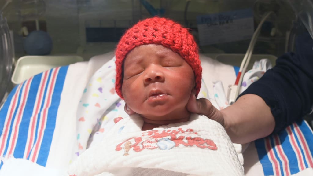 Reds And Trihealth Give Blankets To Opening Day Babies