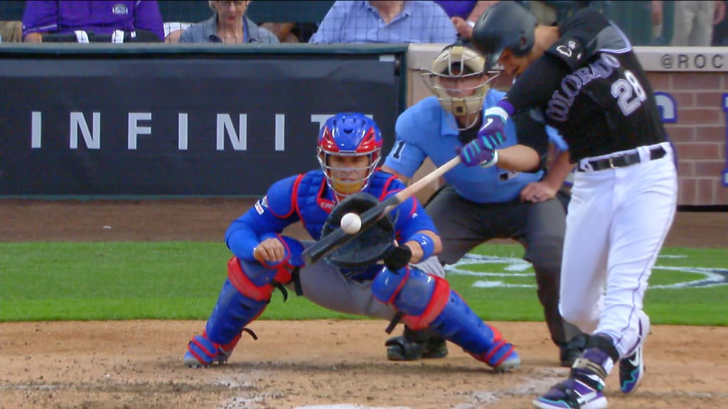 Colorado Rockies third baseman Nolan Arenado smiles as he holds up