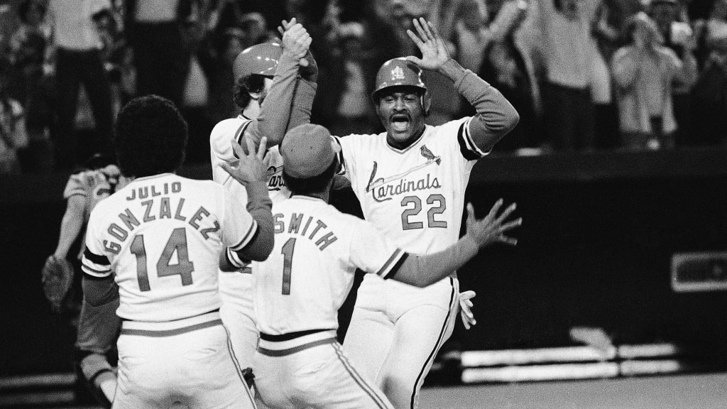 Green celebrates with Julio González and Ozzie Smith after crossing the plate as the walk-off run in Game 2 of the 1982 NLCS.