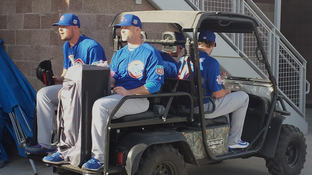 Lefty Jon Lester and catcher David Ross head to Tuesday's workout. (Carrie Muskat/MLB.com)