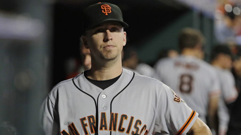 San Francisco Giants' Buster Posey walks in the dugout during the sixth inning of a baseball game against the New York Mets, Tuesday, Aug. 21, 2018, in New York. (AP Photo/Frank Franklin II)