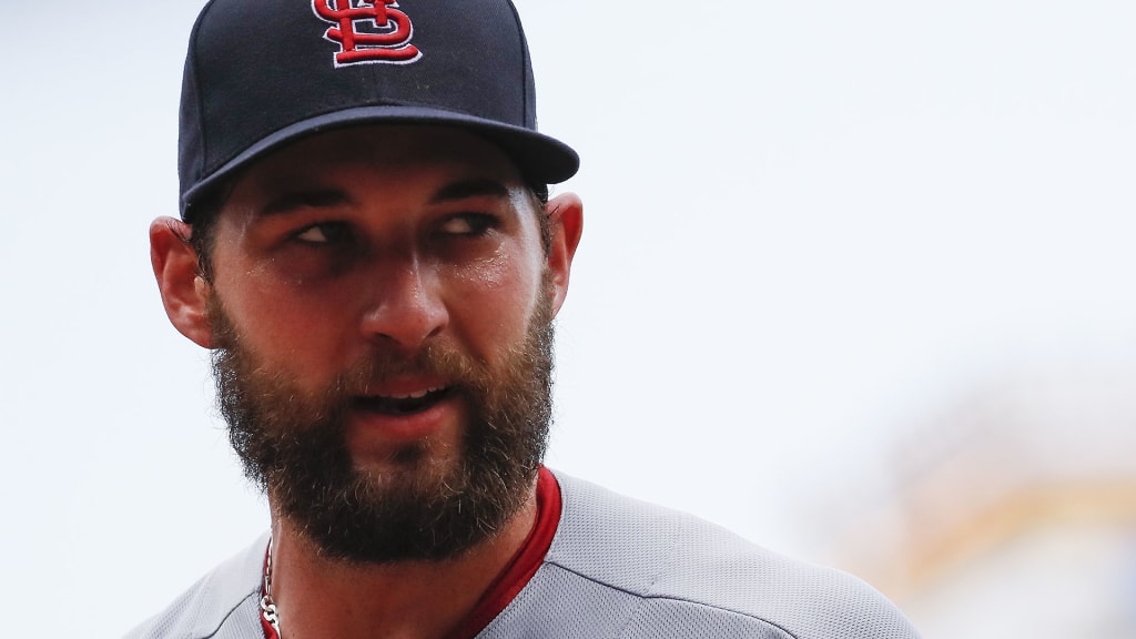 St. Louis Cardinals starting pitcher Michael Wacha, left, meets with catcher Yadier Molina (4) after closing the fourth inning of a baseball game against the Cincinnati Reds, Saturday, June 9, 2018, in Cincinnati. (AP Photo/John Minchillo)
