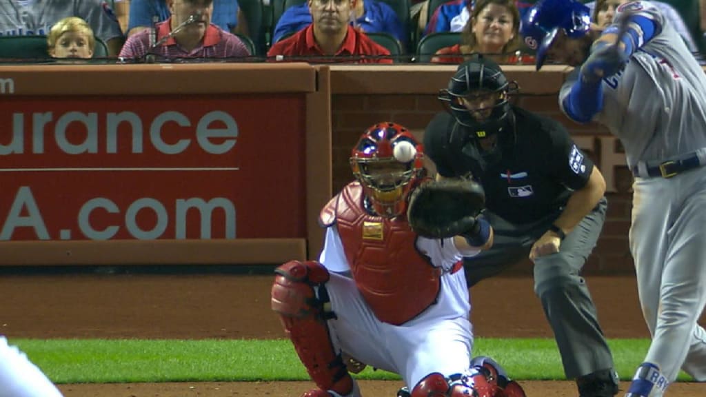 Yadier Molina exits after foul balls to mask